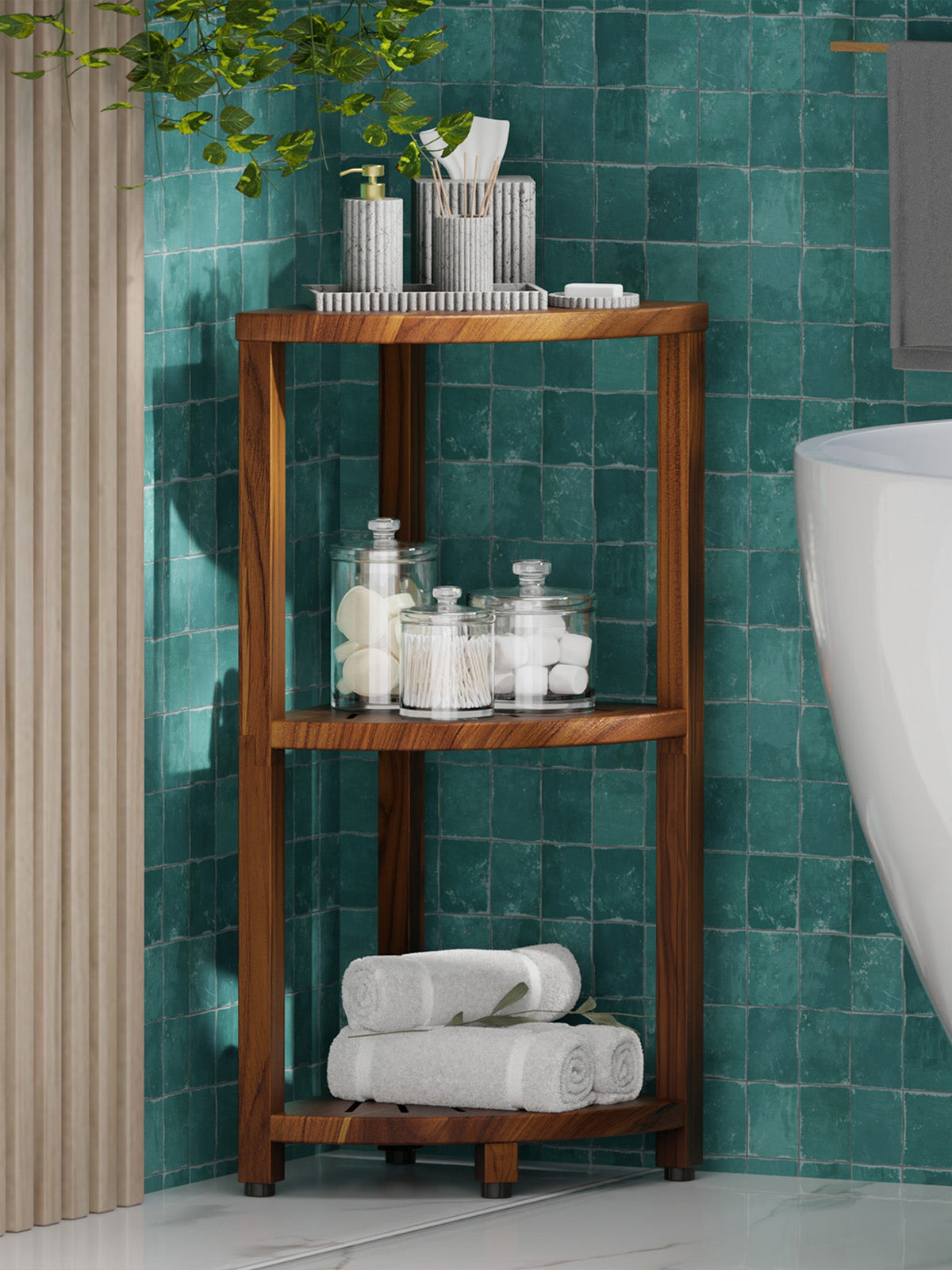 Wooden shelf with towels and bottles against a teal tiled wall