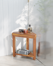 Wooden shower bench with items on top in a bathroom setting