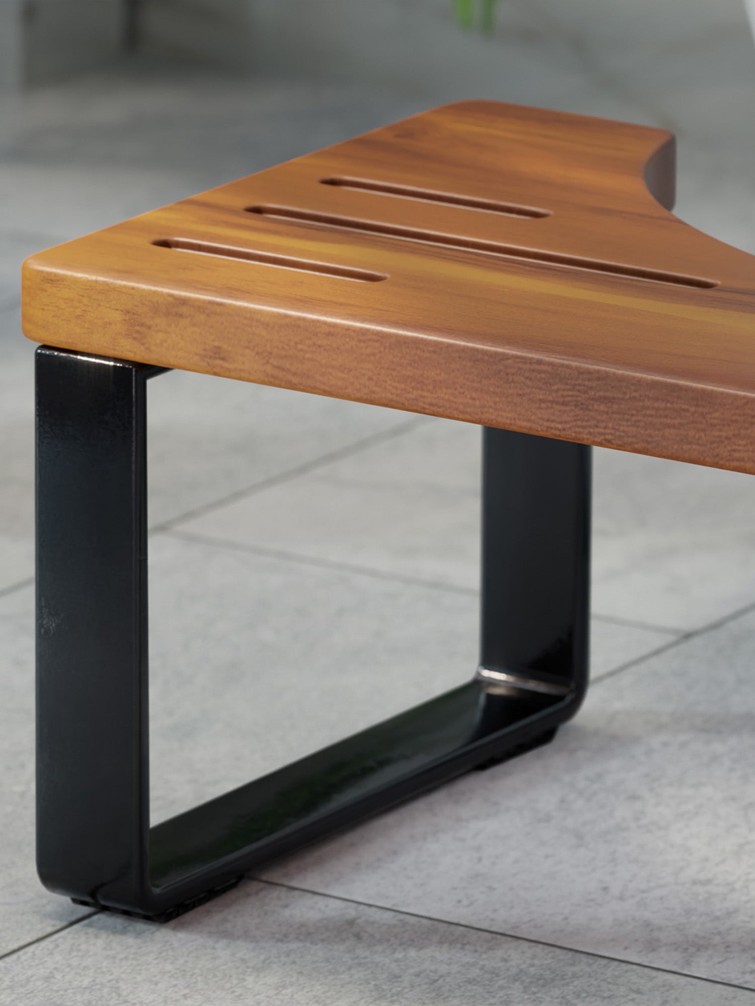 Wooden stool with black metal legs on a tiled floor