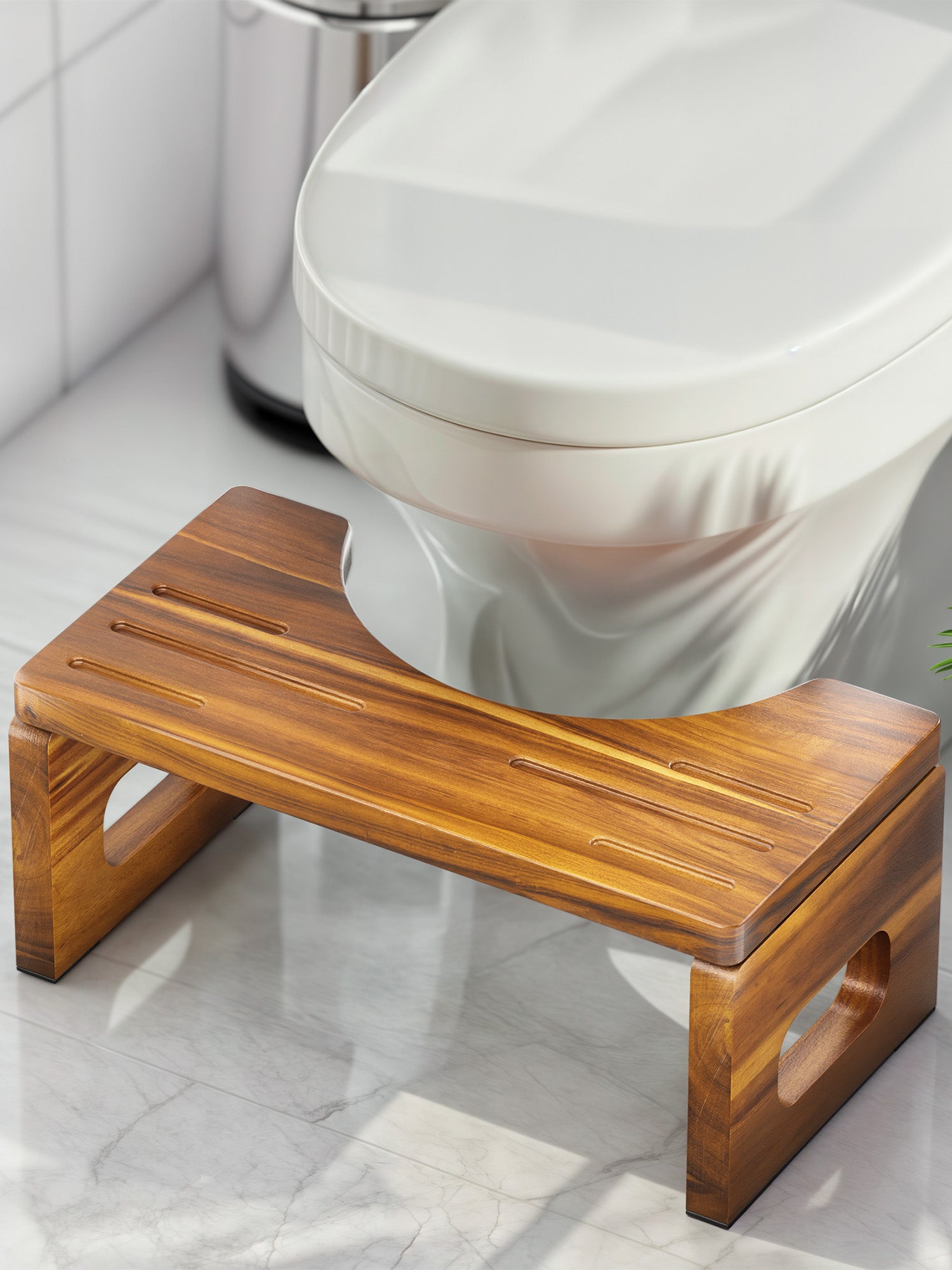 Wooden step stool in front of a toilet in a bathroom setting