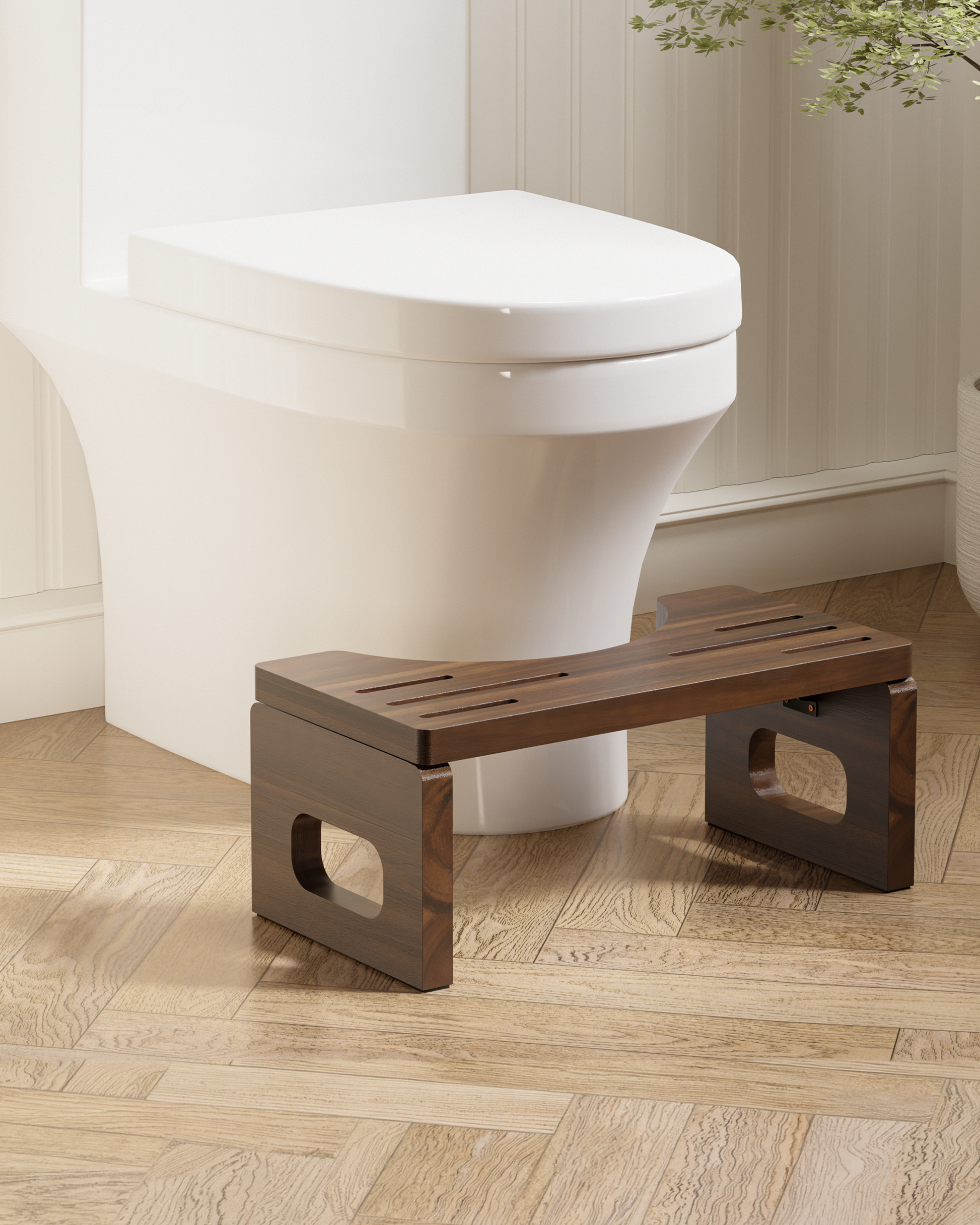A dark brown wooden toilet step stool placed in front of a white toilet on a light wood herringbone floor.