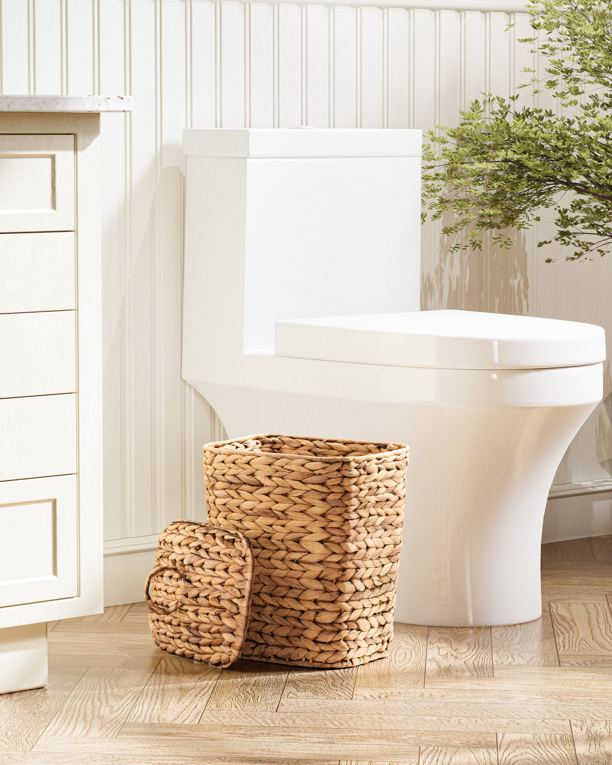 Bathroom with a white toilet and woven basket on a wooden floor.