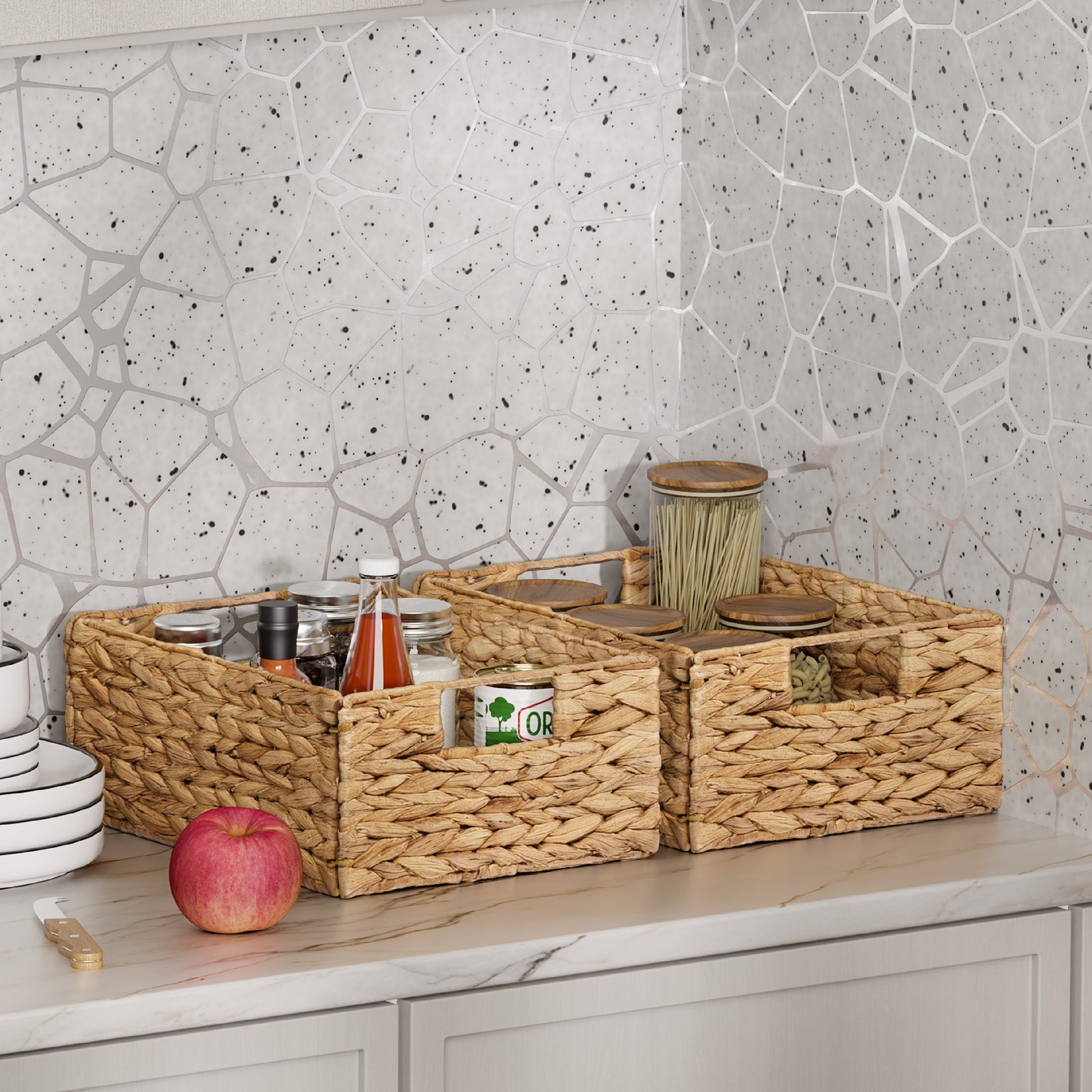 Woven baskets on a kitchen counter with a geometric-patterned wall in the background