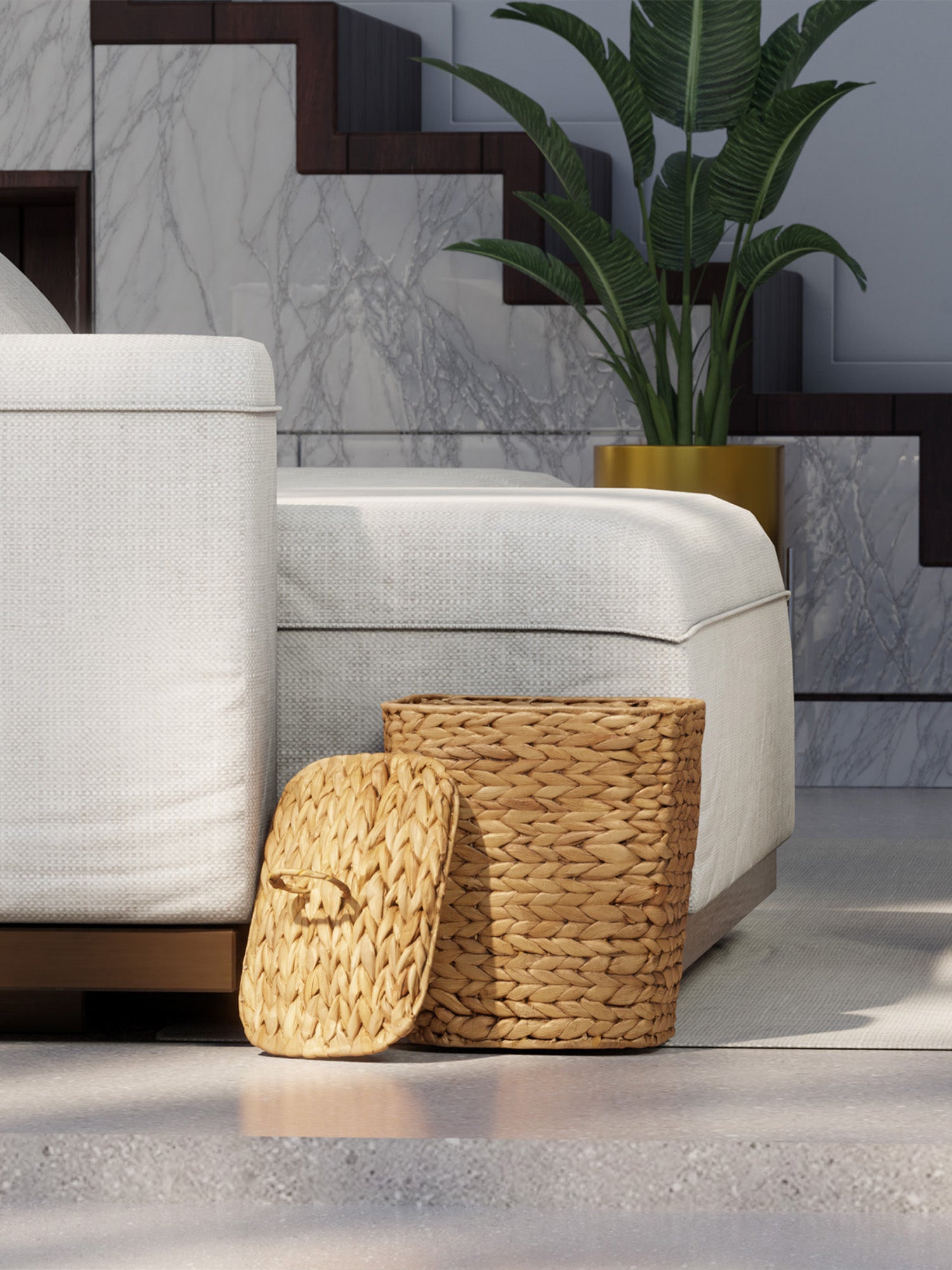 Woven storage baskets on a concrete floor with a marble wall in the background